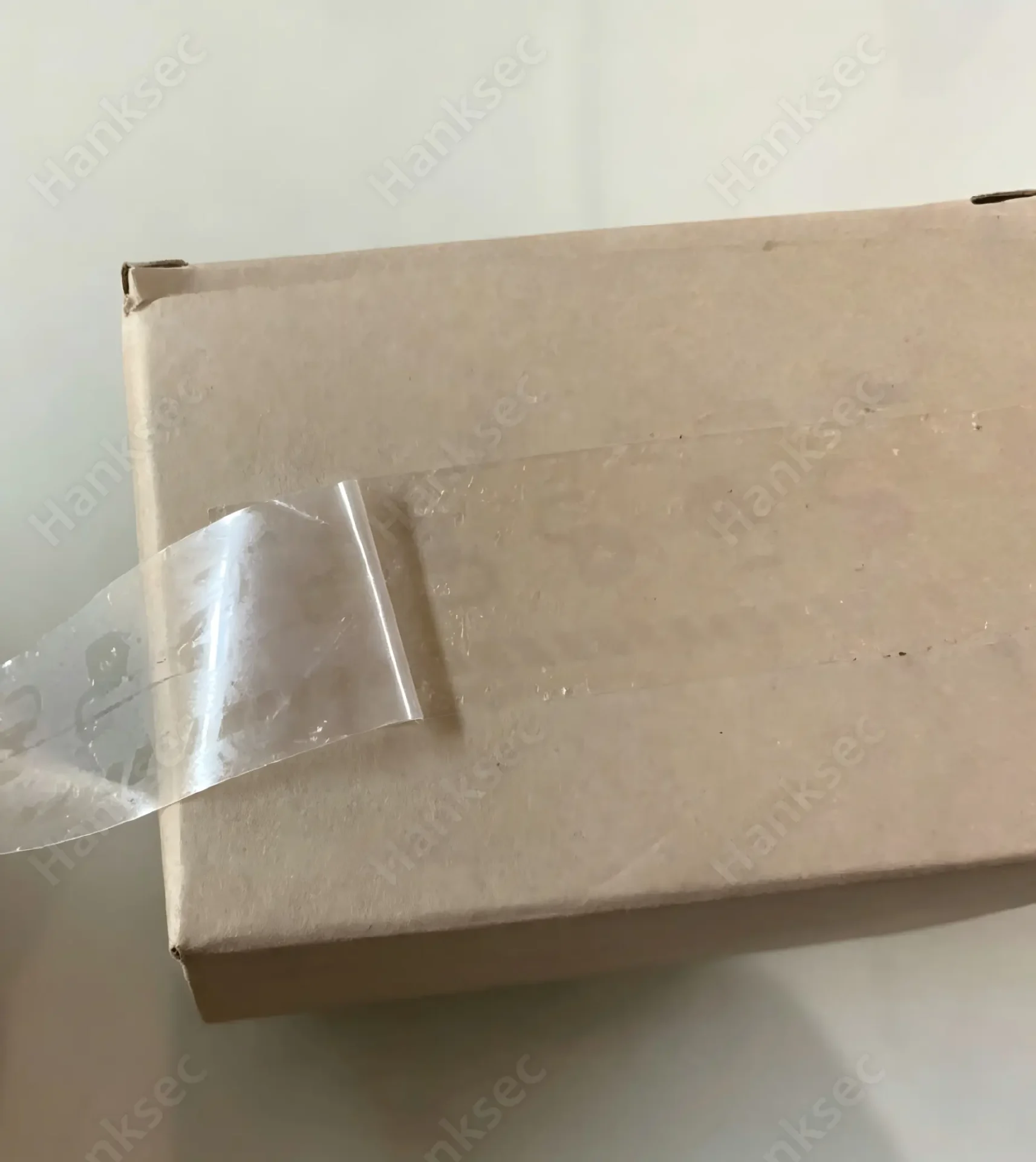 Transparent Void Label Peel Test On Paperboard Box